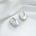 Macro shot of polished silver U-shaped hoop earrings on elegant white satin fabric - 4# White Gold 19x28x11mm