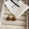 French vintage oval metal earrings with amber resin drops on cream textured background - Dark Coffee