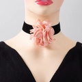 Detailed view of oversized pink silk flower on a black velvet choker necklace - Necklace / Pink