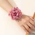 Close-up of elegant pink satin rose wristband showing detailed layered flower petals - Bracelet / Purple