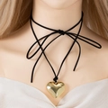 Adjustable bow wax cord choker with a polished gold-tone heart pendant on a mannequin - Short Choker Style / Gold