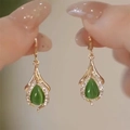 Elegant gold drop earrings with green cat-eye stone and white zircon accents - Green