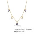 Detalle de collar de acero dorado con colgantes de ojo turco azul y circonitas - Estilo Ojo Turco 2 (NC-2585G)