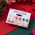 Detailed view of Christmas earring set with Santa Claus and tree patterns on display card - Santa Claus and Snowman Style (1)