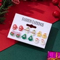 Close-up of festive Christmas earrings set featuring Santa, snowmen, and trees - Snowman And Christmas Tree Style (2)