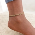 Elegant 18K gold plated curb chain anklet shown on beach sand backdrop - Gold Cuban Chain (JC-062G)
