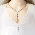 Long Y-shaped necklace with colorful crystals on a silver chain worn over a white knit top - Silver Multicolor Stones Y-Shape (289yin)
