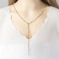 Elegant gold Y-shaped necklace with heart links and crystal tassels on a mannequin - Gold 80cm