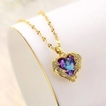 Golden heart necklace with gradient purple blue crystal and sparkly feathered wings - Gold