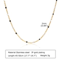 Detail of 2mm black and white beads on a gold-plated stainless steel chain necklace - Gold Necklace - Black and White Beads (NC-1236GBW)
