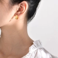 Minimalist triple-layered gold U-shaped cuff earring shown on a model's ear - Gold U-Shape Triple Line (EBS-103G)