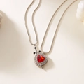 Macro shot of red heart gemstone pendant with silver sword design and sparkling zircon detail - Silver Red Heart Sword Style (11472)