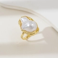 Elegant gold baroque pearl ring with wavy textured band on a minimalist background - Gold Ring