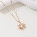 Gold sun pendant necklace with moon and star design on a white display stand - Water Wave Chain Style / Gold Necklace 1