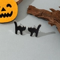 Detail view of black cat silhouette earrings with Halloween pumpkin and wood decor - Black Cat Studs