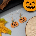 Halloween pumpkin earrings with orange enamel and gold hooks on an autumn leaf background - Classic Smiling Jack-O'-Lantern Style (3)