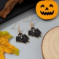 Detail of Halloween ghost hook earrings with black enamel and gold frame on festive decor - Black and Gold Ghost Style (4)
