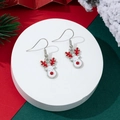 Detailed view of Christmas reindeer hook earrings with red antlers on a festive backdrop - Elk Face Style (6)