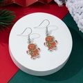 Detail of gingerbread man drop earrings with colorful enamel on a festive background - Gingerbread Man Style (20)