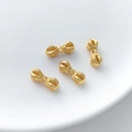 Detailed view of gold vajra beads with religious carvings for DIY jewelry making - Vajra Shape Spacer Bead (14#) / 1 Piece (6x15.8mm)