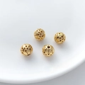 Detailed macro of four gold hollowed-out floral round beads for DIY jewelry making - Small Cloud Pattern Hollow Ball (15#) / 1 Piece (7.5mm)