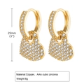 Close-up of gold heart hoop earrings with AAA cubic zirconia pave setting detail - Gold