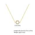 Macro detail of gold flower pendant with zircons showing 1cm diameter and fine chain - Sunflower Necklace (NC-2235G) / 18K Gold