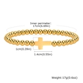 Guide des tailles du bracelet à billes dorées avec pendentif croix et 17cm de tour - Or