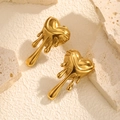 Modern gold plated liquid lava heart earrings on a textured stone display pedestal - Gold Lava Fluid Heart Style (#0668)