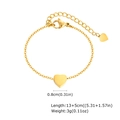 Detailed view of golden heart anklet with polished pendant and adjustable chain sizing - Gold