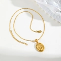 Detailed close-up of a gold oval Virgin Mary pendant necklace with zircon and relief design - Zirconia Style-With Chain (PN-2158G)