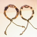 Bracciale etnico in ceramica con perline, motivi ossei oracolari e cordino intrecciato - MU02