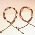 Braccialetti etnici in perline di ceramica con scritte antiche e corde intrecciate - MU04