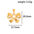 Macro view of gold bow pendant with pearl inlay showing 27.7mm width and 20.2mm height - DHJ02 Style / Gold