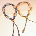 Bracciale etnico in ceramica con motivi ossei oracolari e cordino regolabile - MU13