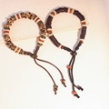 Bracciale etnico in ceramica con perline in osso d'oracolo e cordino intrecciato regolabile - MU18