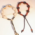 Bracciale etnico in ceramica con perline, motivi ossei oracolari e cordino intrecciato - MU25