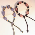Bracciale etnico in ceramica con perline viola e marroni e cordini intrecciati - MU27