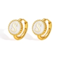 Golden stainless steel hoop earrings with white enamel round pendant featuring letter S - S