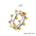 Détail d'une bague à billes en acier bicolore avec largeur de 1,1 cm et poids de 9g - US 7 / Bicolore Or