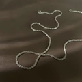 Elegante zilveren maan ketting met zirkoon details op een luxe donkerbruine lederen basis - Zilver