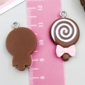 Ciondolo lecca-lecca in resina marrone cioccolato con fiocco rosa e spirali bianche - Marrone Caffè