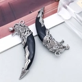 Antique silver wolf tooth pendants with intricate ethnic carvings and black resin finish - Double Sided Black Fierce Wolf Head Style