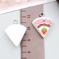 Pink resin strawberry cake pendant with silver metal loop shown on a ruler scale - Triangle Strawberry Cake (24588)