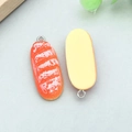 Realistic resin baguette charm for DIY jewelry with silver metal jump ring and glossy finish - Orange Resin White Cream Long Bread (17083)