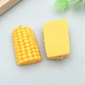 DIY yellow resin corn charms for jewelry making with silver rings on grey background - Yellow Resin Half Face Corn (24637)