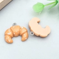 Miniature resin croissant pendant charm with realistic texture and silver metal loop - Yellow Resin Croissant (24640)