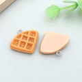 Miniature orange resin waffle charm with silver loop for DIY jewelry and crafts - Yellow Resin Crepe Bread (24642)
