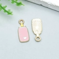 Pink enamel baby bottle charm with white heart detail and gold plating for DIY jewelry - Scale Ruler Heart Feeding Bottle (22984)