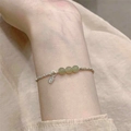 Minimalist S925 silver beaded bracelet with green nephrite jade stones on a wrist - Model 1271 Three Jade Beads (5244723818295)